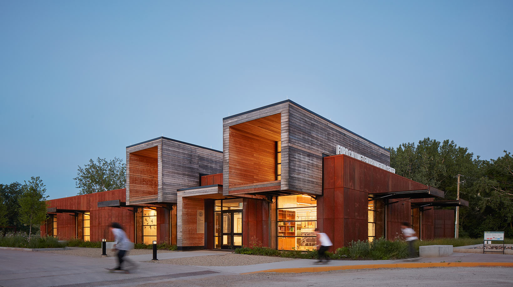 A building with a few people walking past.