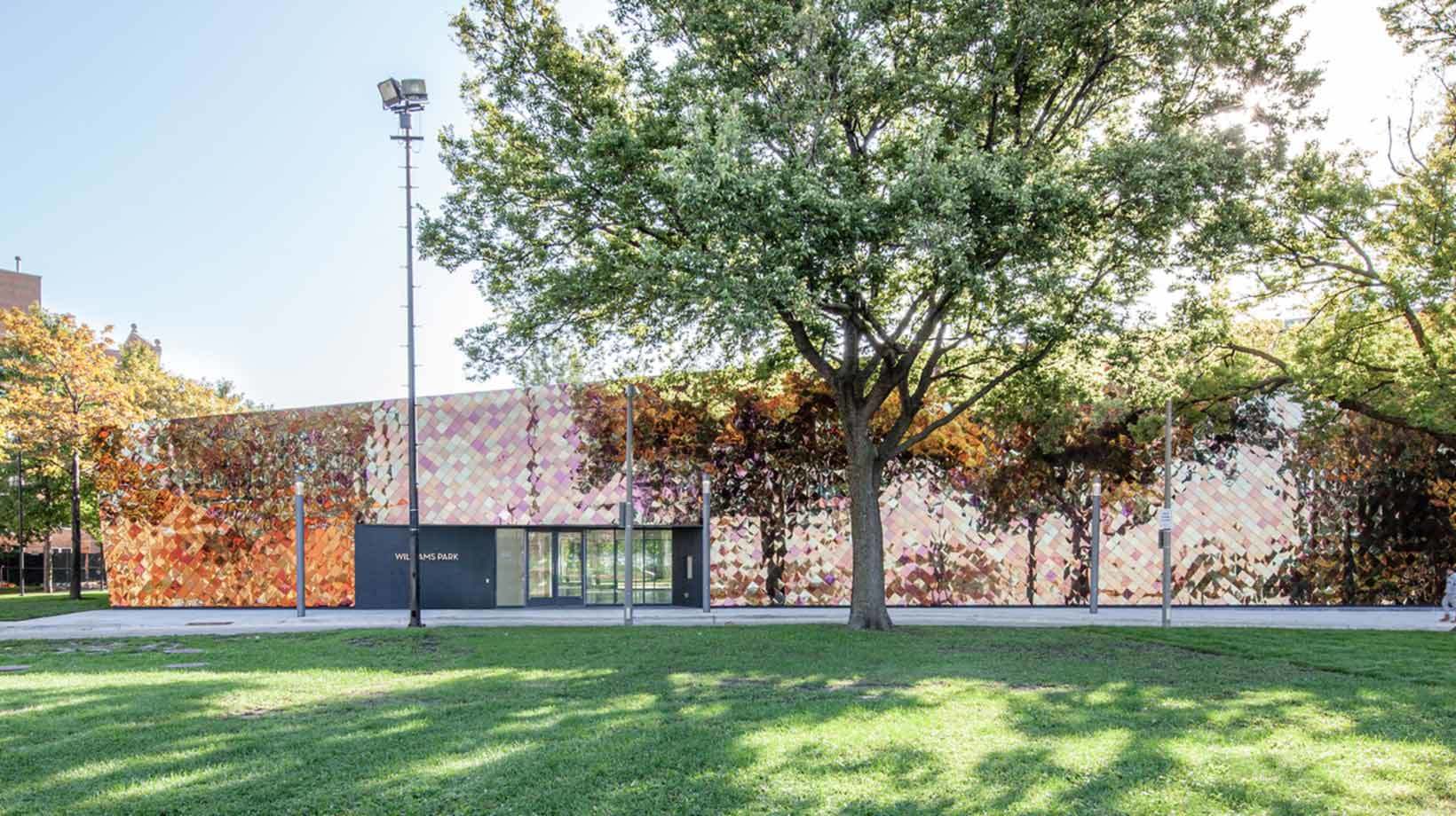 A building with a tree in front of it.